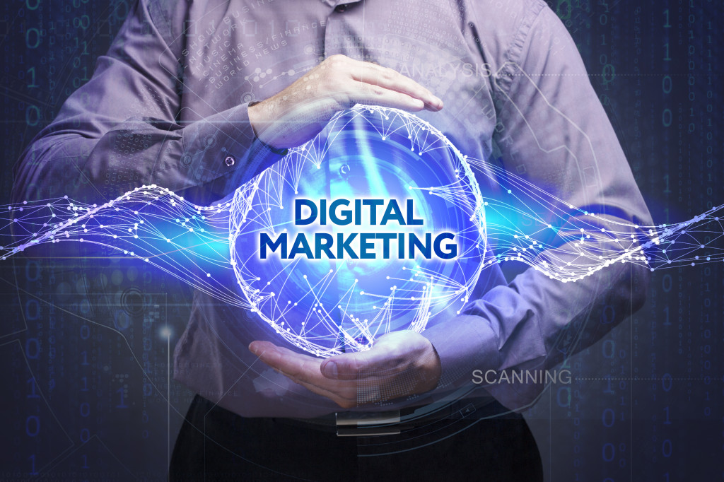 man holding digital marketing globe