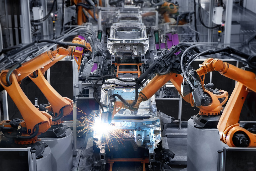 Robots used in manufacturing cars.